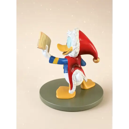 Weihnachtsstatue von Donald Duck beim Lesen seiner Liste – Disneyland Paris