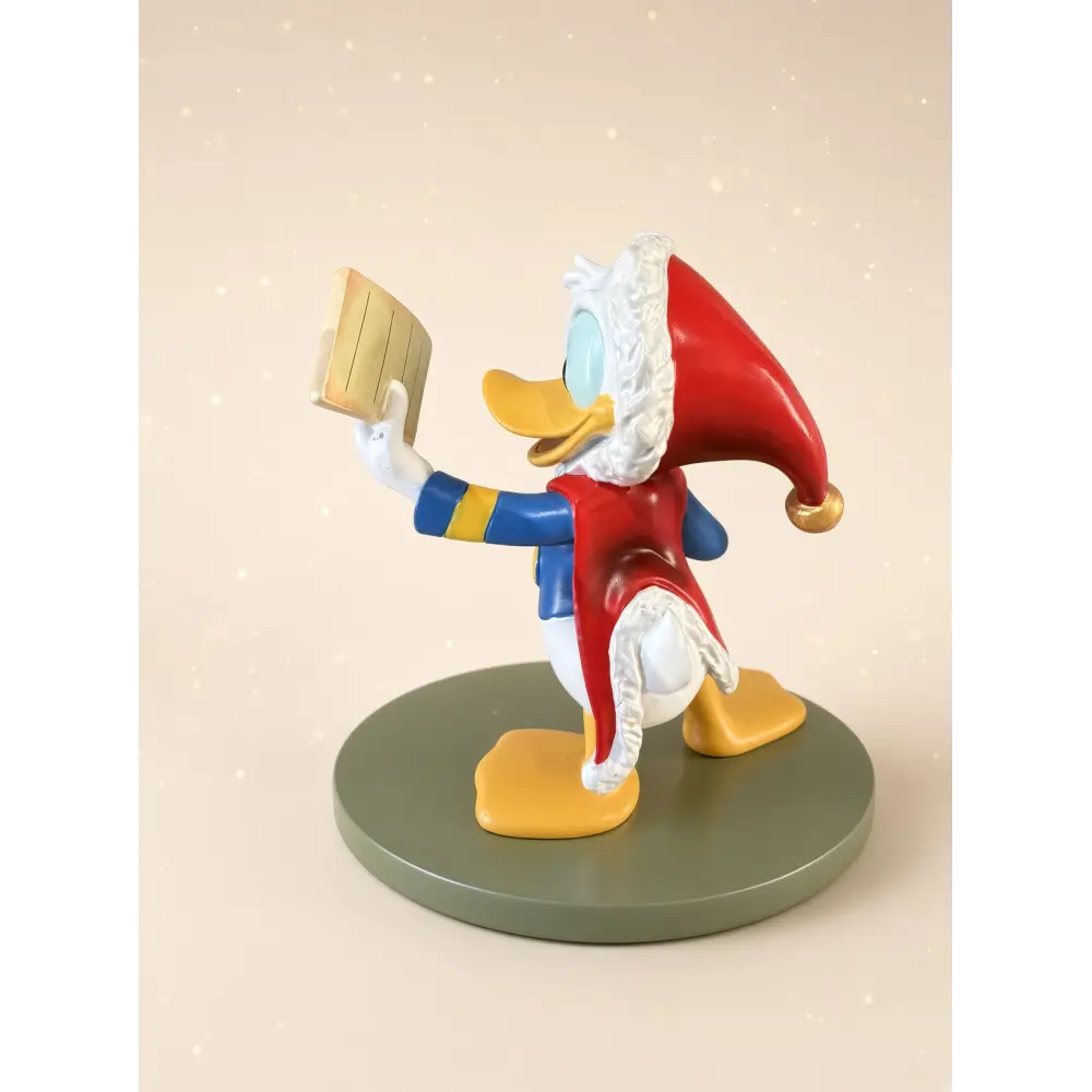Weihnachtsstatue von Donald Duck beim Lesen seiner Liste – Disneyland Paris